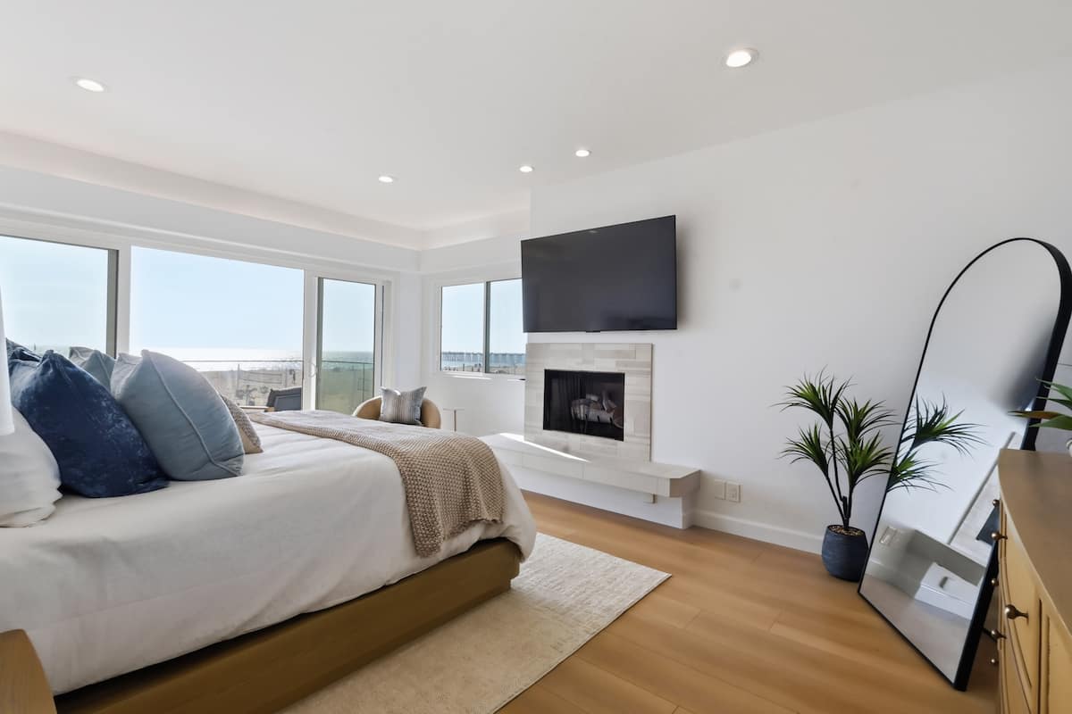 Primary bedroom with a direct view of the ocean