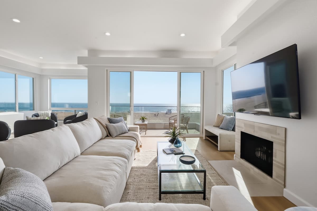 Oceanfront great room opening to a panoramic Pacific view