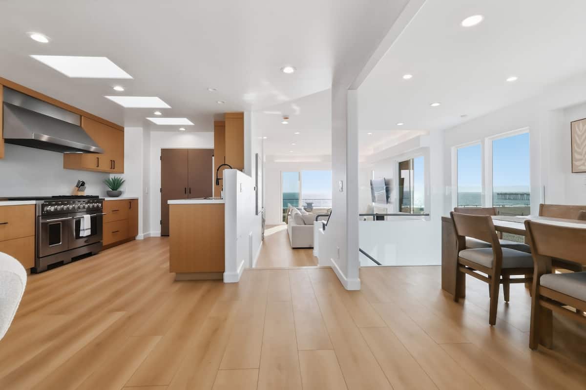 Kitchen and dining spaces opening toward the ocean