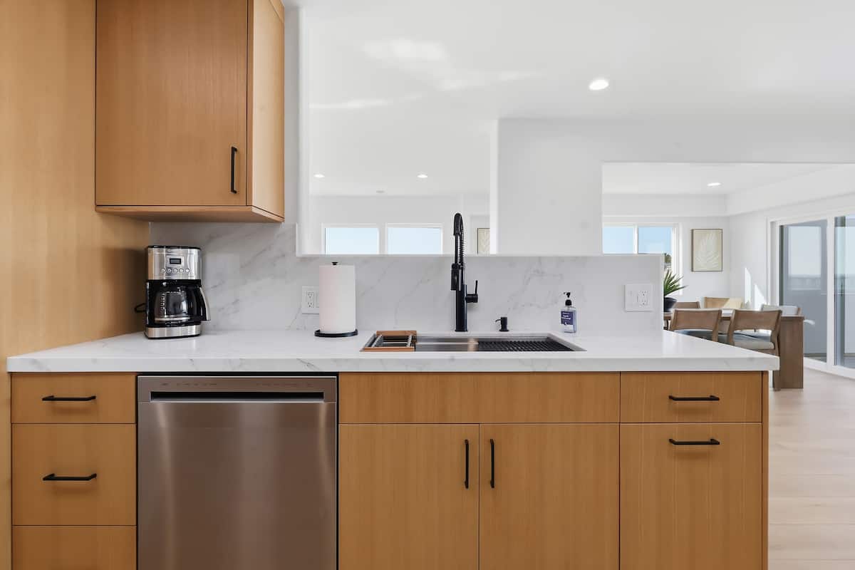 Kitchen sink and pass-through opening toward the living spaces