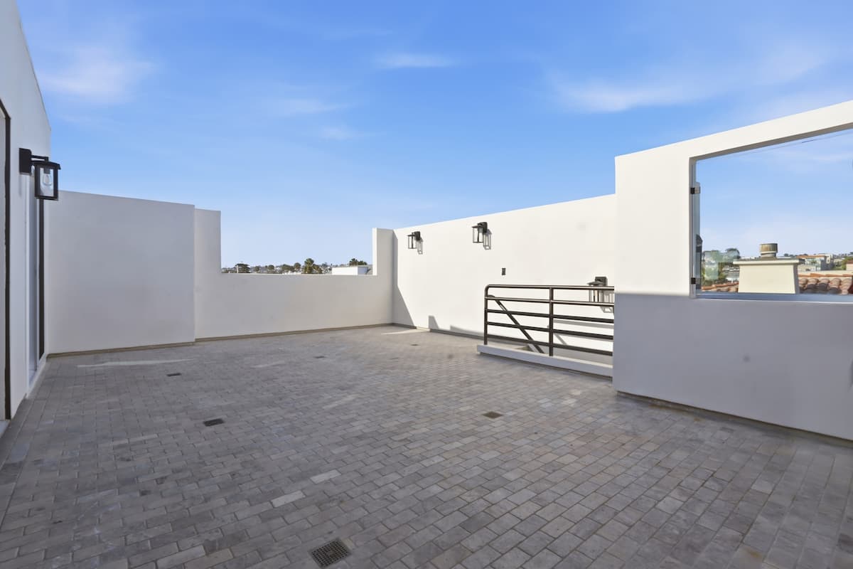 Private rooftop deck with open sky and ocean air